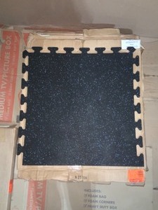 lot 31 image: Black with Blue Speck 24 in. x 24 in. Finished Corner Recycled Rubber Floor Tile (16 sq. ft. case) NOT USED 2 CASES ARE 4 PACKS AND ONE CASE IS A 6 PACK SEE PICS