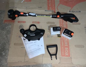 lot 57 image: SCOTTS 20-Volt 12 in. Cordless String Trimmer & SCOTTS 20-Volt 22 in. Cordless Hedge Trimmer, 2.0Ah Battery and Fast Charger Included not used see pics