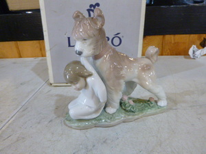 lot 121 image: Lladro Safe and Sound Dog and Child Figurine