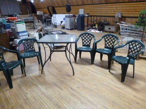 lot 133 image: Patio Glass Top Table with 5 Green Plastic Chairs