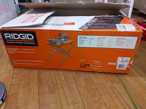 lot 31 image: 9 Amp Corded 7 in. Wet Tile Saw with Stand by RIDGID- missing parts not used