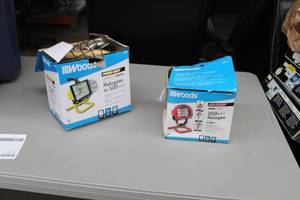 lot 49 image: Lot of (2) Woods Work Lights (both in box) -  Pro Series Work Light 250W Halogen 4-Way,  Power Light Work Light 500W Halogen
