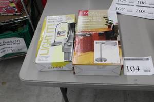 lot 104 image: Lot of (2) Lamps (both in box) - Multiflex LED Work Light, Living Accents Swing Arm Desk Lamp Brushed Steel