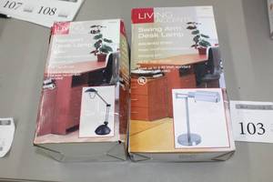 lot 103 image: Lot of (2) Living Accents Desk Lamps (both in box) - Halogen Desk Lamp Black, Swing Arm Desk Lamp Brushed Steel