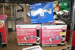 lot 98 image: Lot of (3) House Lighting (all in box) - HeathZenith Motion Activated 110-degree Floodlight (x1),  Ace Wireless System Floodlight Converter (x2)