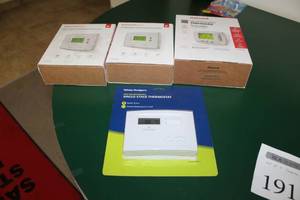 lot 191 image: Lot of (3) House Thermostats (in package) - White-Rodgers Non-Programmable Single-Stage Thermostat, Honeywell Programmable Thermostat, Honeywell Home RTH2300B Programmable Thermostat (x2)