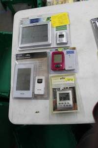 lot 186 image: Lot of (4) Weather Stations (in package) - Oregon Scientific, Taylor 3-Channel Deluxe, Taylor Wireless with Clock, Taylor Deluxe Wireless Forcaster