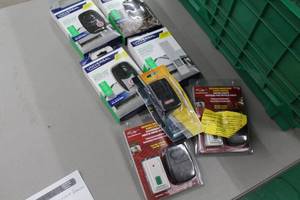lot 180 image: Lot of (7) Garage Door Remotes (in package) - Chamberlain Universal 2-Button, Genie, Sky Link 1-Button (x2), Wireless Keypad