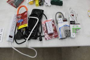lot 211 image: Lot of (6) Surge Protectors and Outlet Adapters (in package) - Ace 3-Outlet Adapter, Home Plus 4 Outlet Power Strip, Just Power 6 Outlet Power Strip, Monster, Ace 3-Outlet Outdoor Power Cord (wrong package)