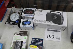 lot 199 image: Lot of (4) Alarm Clocks and Radio (in package) - Big Ben Twin Bell Alarm Clock, Westclox Alarm Clock (x2), GPX Portable AMFM Shortwave Radio