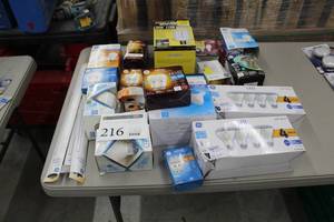 lot 216 image: Lot of (Approximately 20) Light Bulb Packages (in package) - GE LED 1-Pack, GE Refresh LED 2-Pack, GE LED Soft White 65W 4-Pack, GE Soft White 60W 4-Pack, GE LED Soft White 75W 1-Pack, Ace Incandescent 3-Way 2-Pack, GE Bug Bulb, And More