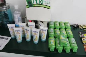 lot 232 image: Lot of Jergens Ultra Healing Lotion 1oz.  (x8), Pert Plus 2-in-1 ShampooConditioner 1oz. (Approximately 24)