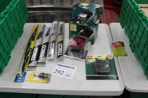 lot 292 image: Lot of Automotive Accessories (in package) - Trico Wiper Blades 1617182024, Head Light Replacement Bulb, GE Headlight, Peterson StopTurnTail Light, Ace Small Engine Muffler For Briggs&Stratton