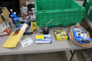 lot 289 image: Lot of Automotive Supplies and Sterno Canned Heat - Oil Can, Fix A Flat, Windshield Protector, Oil Dri, Polishing Cloth, Ice Scraper, Opti-4 SAE 4-Cycle engine Lubricant, Misc. Supplies
