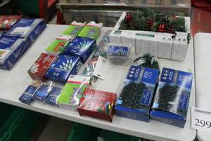 lot 299 image: Lot of (Approximately 18) Christmas Lights (in package) - Warm White LED Castle Hill Garland 6, LED Net String 100-lamp 4x6, Clear Twinkle Mini 100-lamp, Warm White Mini LED 100-lamp, Constant On RedPurple 100-lamp, and more