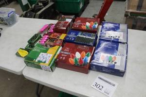 lot 302 image: Lot of Christmas Lights (in package) - Multi-Color C9 LED 25-lamp, Transparent Cool White C9 LED 25-lamp, Warm White Twinkle Net LED 100-lamp, Clear Twinkle C9 25-lamp, 7W Replacement Bulb Pink 4-pack, Misc. Lights