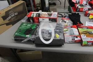lot 305 image: Lot of Grill Accessories (in package) - Traeger Folding Front Shelf, Grill Covers, Hose and Regulator Sets,  Char-Baskets, Misc. Accessories