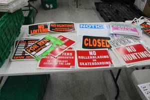 lot 315 image: Lot of Signage - For Sale, Garage Sale, No Hunting, Notice, No Rollerblading, Closed, For Rent, Store Hours, Black Nunbers, Misc. Signage