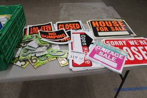 lot 319 image: Lot of Signage - Garage Sale, Estate Sale, Take One Tube, Yes Were Open, House For Sale, Sorry Were Closed, Open House, No Dumping, Closed, Keep Out, Brass Numbers, Reflective Numbers, Misc. Signage