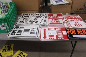 lot 320 image: Lot of Signage - Speed Limit 15 mph, Speed Limit 10 mph, Speed Limit 5 mph, No Parking, Caution Children At Play, For Rent, Numbers and Letters, Misc. Signage