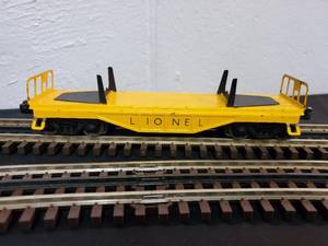 lot 112 image: Early Lionel O Scale Tin Log Hauling Rail Car