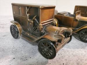 lot 131 image: (3) Banthrico Inc Metal Cast Bank Cars