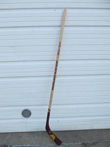 lot 148 image: Full Size U of M Golden Gophers Wooden Hockey Stick - Autographed by Don Lucia