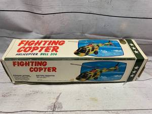 lot 16 image: VintageWoolworthFighting Copter Bell 206Helicopter