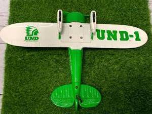 lot 18 image: Vintage UND Fighting Sioux Metal Airplane LimitedEdition
