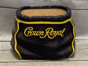 lot 100 image: SeagramsCrown Royal Ceramic Bottle Pedestal (sold for $79.99 on Ebay)