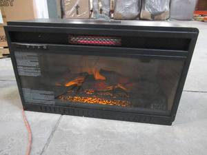 lot 318 image: Quantum Flame Infrared Fireplace Insert, Dimensions of Box 30 x 8 x 18 Tall. - Side fins are dented.