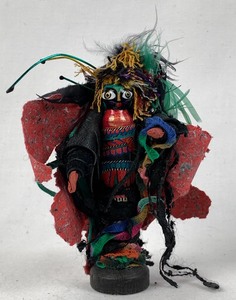 lot 107 image: Bright Folk Art Doll Trimmed In Leather, Hand-Made Paper and Feathers, 4.75 Tall
