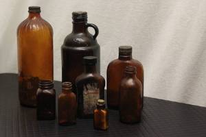 8 brown bottles, ...