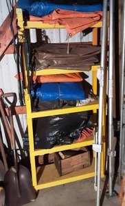 Shelf Full Of Tarps, Bungee Cords & Lead Bars