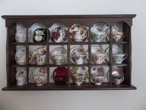 lot 15 image: 18 Place Cup & Saucer Display Shelf Includes England Cups & Saucers 36x20