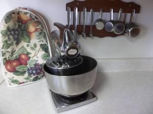lot 72 image: Sunbeam Stand Mixer With Measuring Cups In Wall Rack