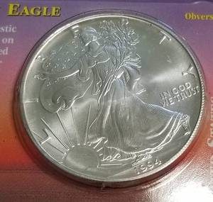 lot 17 image: 1994 AMERICAN SILVER EAGLE 1 TROY OZ. .999 FINE SILVER DOLLAR