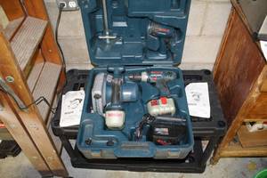 lot 11 image: Bosch 24V Cordless Circular Saw 6-12, 24V Cordless Drill, 24V Batteries (x2), 7.2V -14.4V 1 Hour Charger BC004, Plastic Case