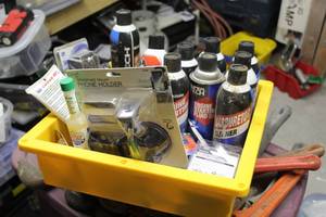 lot 72 image: Lot of Automotive Chemicals and Accessories - Starter Fluid, Carb Cleaner, White Lithium Grease, Phone Holders, 100W Inverter, Misc. Accessories