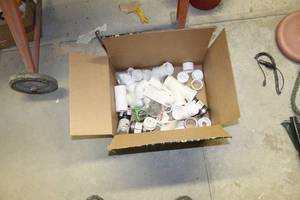 lot 184 image: Lot of Plumbing Supplies - PVC Pipe Connectors, Drain and Trap Connectors