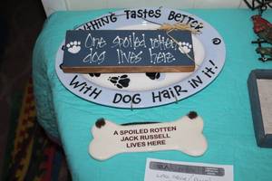 lot 320 image: Lot of (3) Dog Wall Dcor - One Spolied Rotten Dog Lives Here, Everything Tastes Better With Dog Hair In It, A Spolied Rotten Jack Russell Lives Here