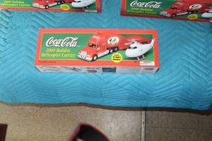 lot 365 image: Coca-Cola 2000 Holiday Helicopter Carrier with 1962 Replica Helicopter Limited Edition Collectible (in box)