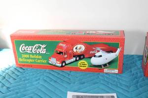 lot 367 image: Coca-Cola 2000 Holiday Helicopter Carrier with 1962 Replica Helicopter Limited Edition Collectible (in box)
