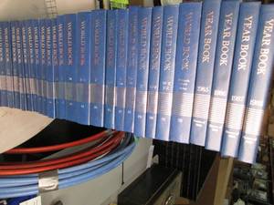 lot 77 image: World Books volumes 1-22 as well as...