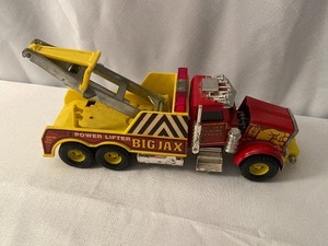lot 140 image: 4 Vintage Toy Trucks & 1 Toy Ertl Trailer- Tootsie Toy, Metal Masters, Ertl Big Jax, & Matchbox