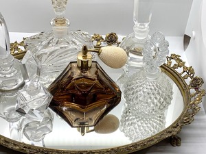 lot 91 image: Oval Vanity Mirrored Tray and Six Perfume Bottles
