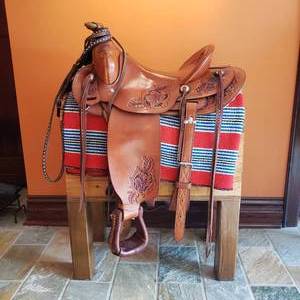 lot 26 image: Tooled Leather Western Saddle by Gales Saddles Lewiston Montana  16 inches