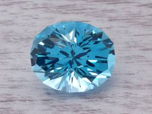 lot 10M image: Designer 23.95 Carat Brazilian Tahoe Blue Topaz, Custom Cut Designed by Marco Voltolini $2,500 Retail