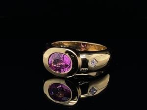lot 23 image: 1.35 Carat Natural Pink Sapphire and Diamond Bezel Set Estate Ring in 18k Yellow Gold $6900