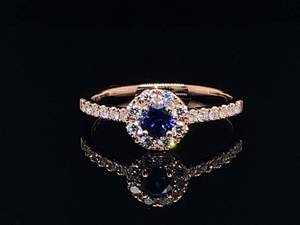 lot 40 image: Luxurious Cashmere Blue Sapphire and Diamond Halo Ring in 14k Rose Gold $3,000 Retail